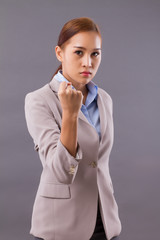 aggressive angry asian businesswoman; portrait of confident professional asian business woman boss...