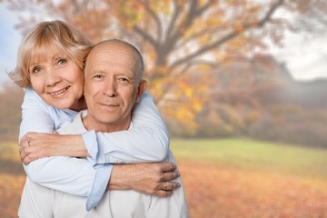 Fototapeta premium Portrait of happy senior couple smiling
