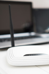 Obraz na płótnie Canvas White wireless router standing on the table.