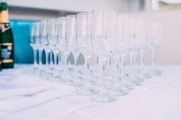 The rows of champagne glasses.