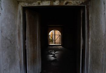 Fototapeta premium Ancient doorway leading to a dark room