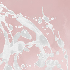 Luxury rose gold and white metal paint splatter effect on watercolor paper background. Pink gold glitter splash texture. Beautiful feminine backdrop.