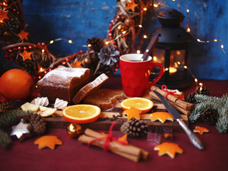 Christmas and New year background with Pie and a mug of coffee on the cutting board,oranges,Tree decorations ,lantern,  lights/top view/flat lay