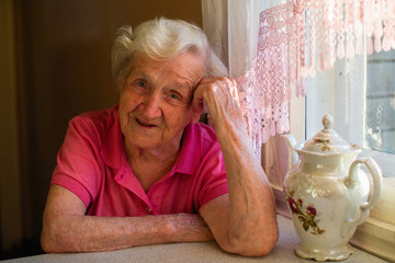 Portrait of an elderly woman in her home.