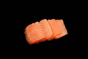 sliced ​​raw salmon on black background