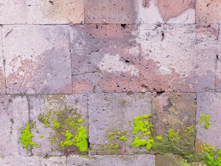pink mossy wall made of armenian tuff texture background