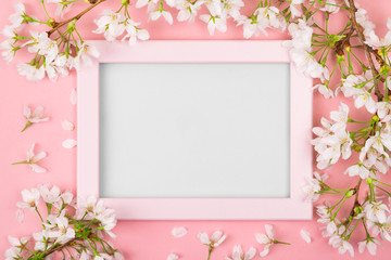 Pink springtime frame with blank space and cherry blossom