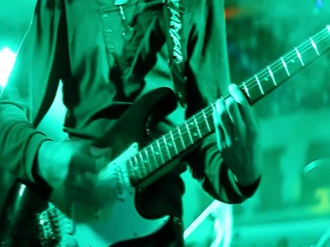 show program, rock music, green light, playing an electro guitar
