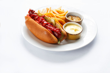 hotdog and french fries on white background