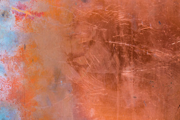 Grunge copper background with colored stains of chemical compounds