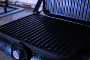 Empty electric grill on the kitchen