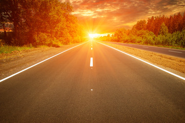 Asphalt car road and clouds