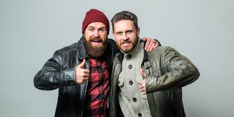 Real men and brotherhood. Friends glad see each other. Friendly relations. Friendship of brutal guys. Real friendship mature friends. Male friendship concept. Brutal bearded men wear leather jackets