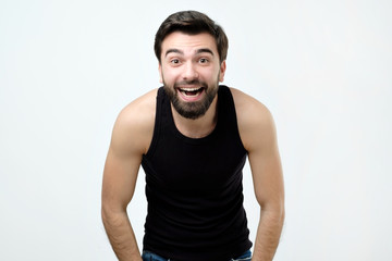 Portrait of a handsome young man laughing
