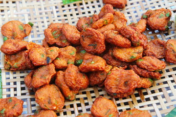 Street Food Thailand. Thai Spicy Fish Cakes or Spicy Thai Fish Cakes. Deep Fried Fish Paste Balls