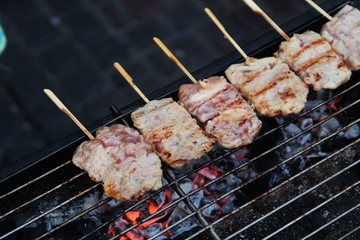 Street Food Thailand. Barbecue Pork Toast Grill or Grilled Pork with Sweet Spicy Sauce. Grilled Pork Cooking