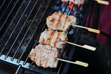 Street Food Thailand. Barbecue Pork Toast Grill or Grilled Pork with Sweet Spicy Sauce. Grilled Pork Thailand style at Fresh market in Thailand