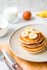 cooked pancake on plate at wooden background