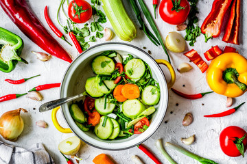 cooking vegetables on the stone background top view