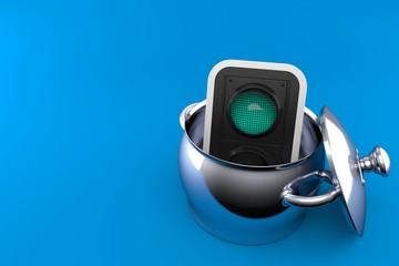 Green traffic light inside kitchen pot