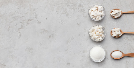 Collection of different kinds of sugar on gray background