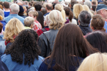 rear view of anonymous crowd of people                               