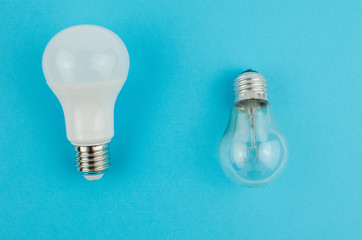 incandescent lamp and energy saving on a blue background