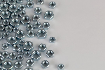 Metal nuts on white background