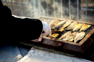 sea ​​fish mackerel on grill during the feast of fish in Bourgas, Bulgaria 06 December. grilled fish and healthy eating.