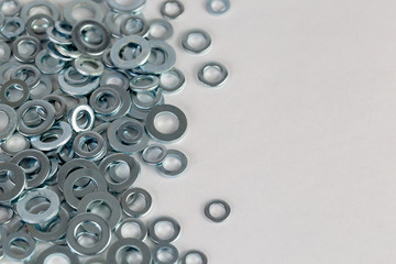 Washers in a pile arranged to left