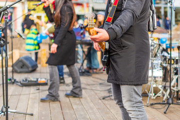 a music group is playing a music street festival in Burgas/Bulgaria/12/06/2018/ rock and pop orchestra play music.