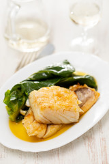 fried cod fish with cabbage on white dish