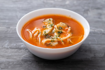 fish soup in the white bowl