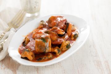 fish with seafood and sweet potato on white dish