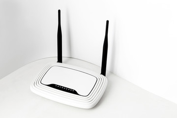 White router with two black antennas