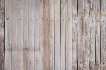 Obraz premium Old bamboo wood fence with nail natural texture abstract for brown background
