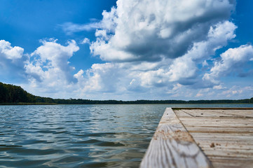 Fototapeta premium Empty footbridge over beautiful Lemiet lake in Mazury district, Poland. Fantastic travel destination.