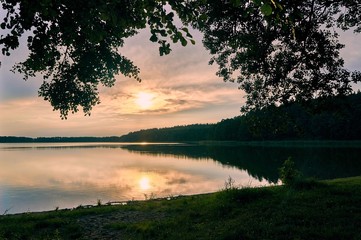 Beautiful panoramic view of the sunset over Lemiet lake in Mazury district, Poland. Fantastic travel destination. - obrazy, fototapety, plakaty