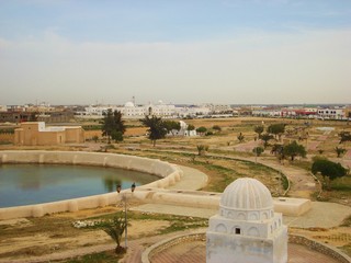 Obraz premium Kairouan, Tunisia - April 10, 2018: View from Aghlabid Basins In Kairouan / al-Qayrawan behind, Tunisia- Cisterns