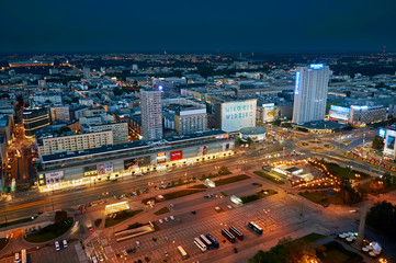 Fototapeta na wymiar Warsaw, Poland - August 27, 2016: Aerial panoramic view to downtown of Polish Capital by night, from the top Palace Culture and Science: Palac Kultury i Nauki, also abbreviated PKiN.