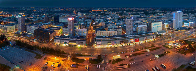 Fototapeta premium Warsaw, Poland - August 27, 2016: Aerial panoramic view to downtown of Polish Capital by night, from the top Palace Culture and Science: Palac Kultury i Nauki, also abbreviated PKiN.