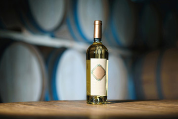 Fototapeta na wymiar white wine bottle at cellar