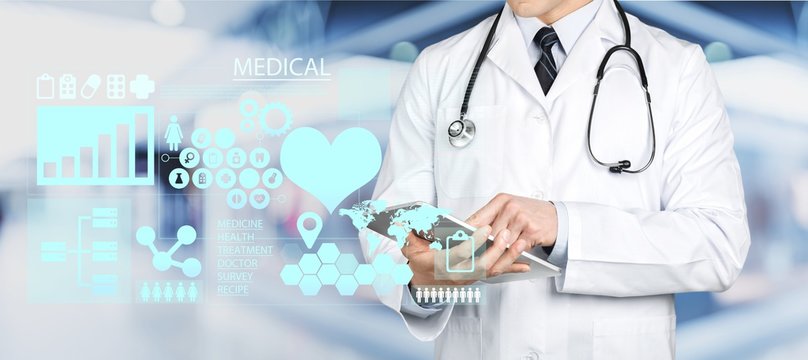 Close-up of male Doctor with stethoscope write digital icons