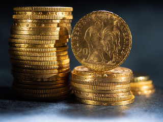 Gold coins over dark background