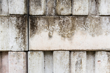 white Interlocking brick wall dirty rough mortar