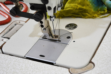 Sewing machine on table in tailor's workshop