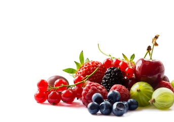 Fruits and berries isolated on white background. Ripe currants, raspberries, cherries, strawberries, gooseberries, mulberries and bilberries. Background of mix fruits with copy space for text. 