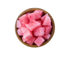 Slices of watermelon isolated on white background. Sweet and juicy fruit with copy space for text. Ripe watermelon close-up. Pieces of watermelon in a wooden bowl.