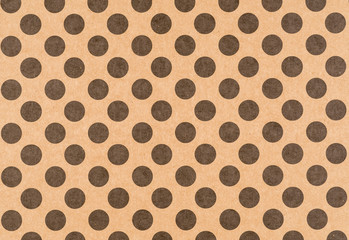 Brown craft paper with a black polka dot pattern