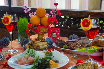 Chinese New Year dinner place setting with decorations.